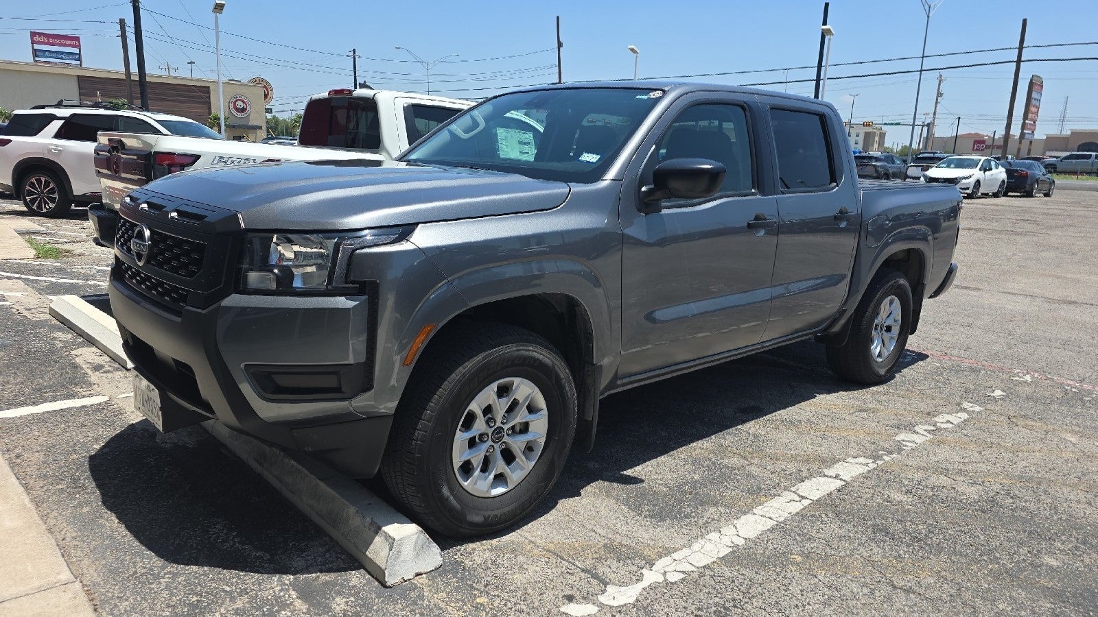 2025 Nissan Frontier S in Gun Metallic — front three-quarter view