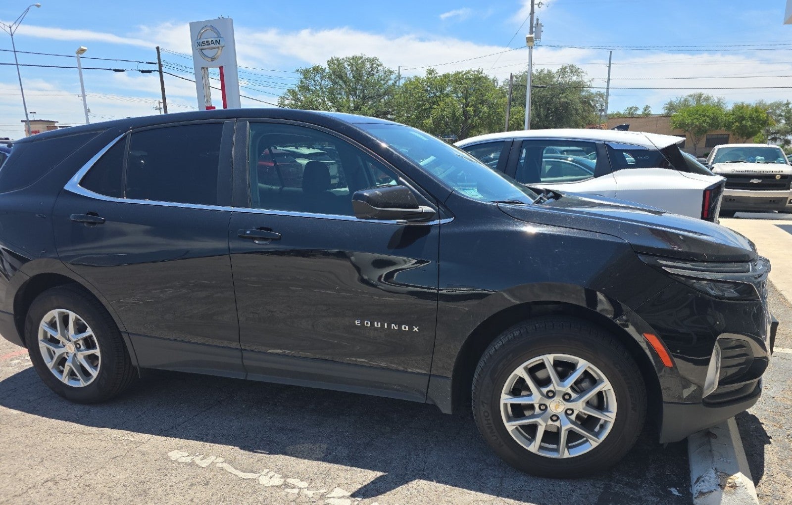 2024 Chevrolet Equinox LT in Mosaic Black Metallic — front three-quarter view