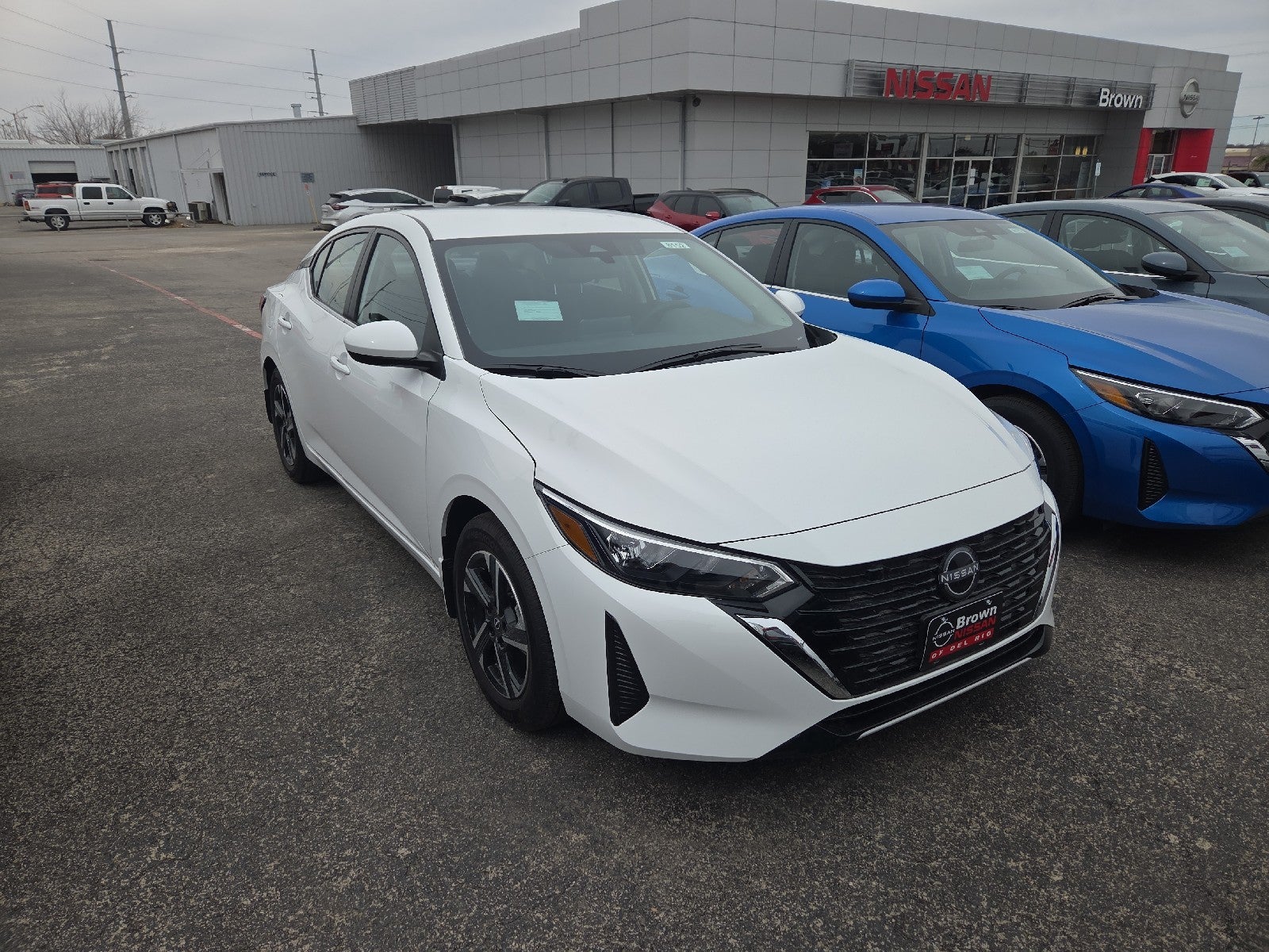 2025 Nissan Sentra SV in White — front three-quarter view