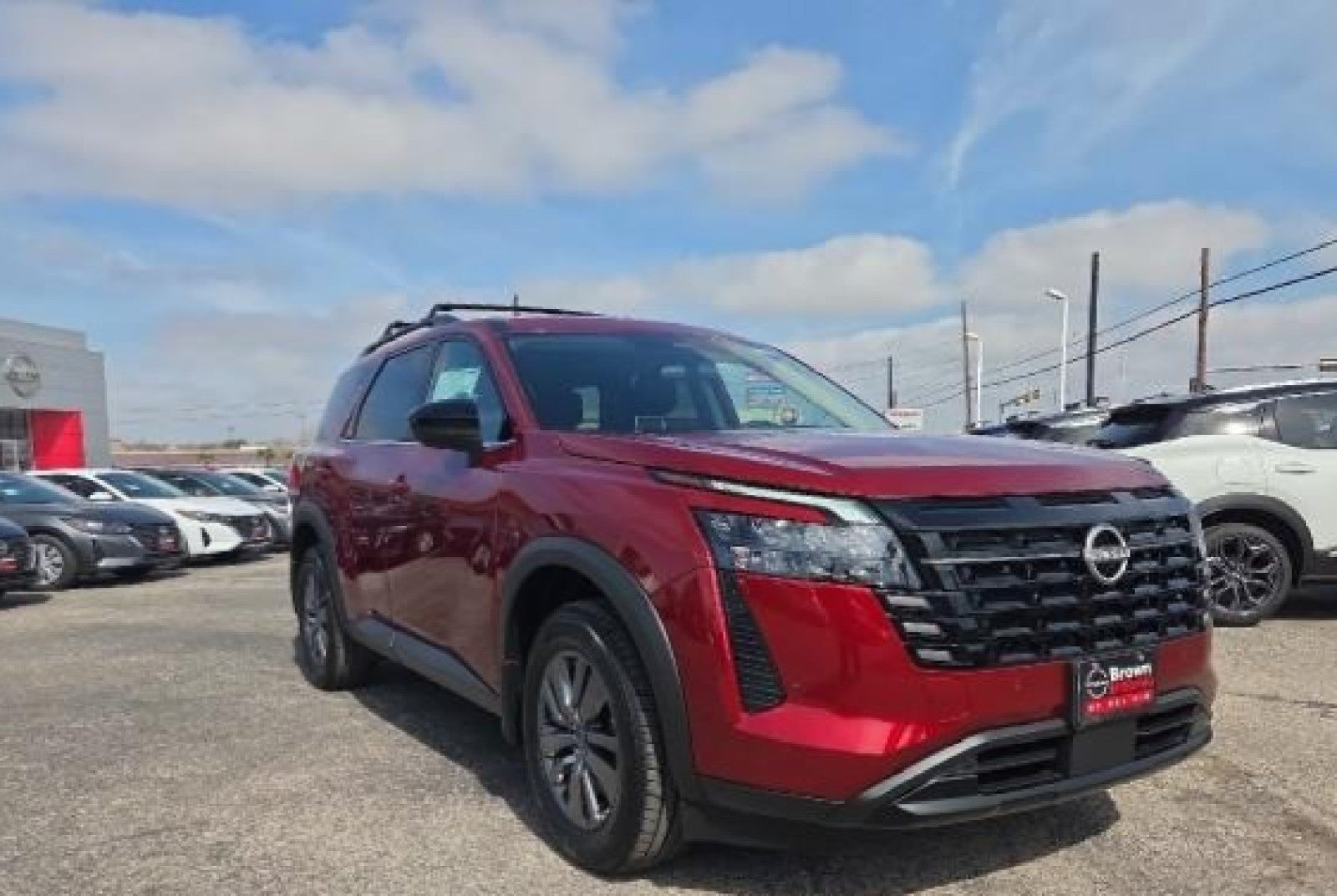 2026 Nissan Pathfinder SV in Scarlet Ember Tintcoat — front three-quarter view